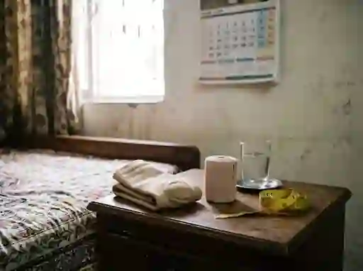Stump shrinker, bandage and tape on a bedside table